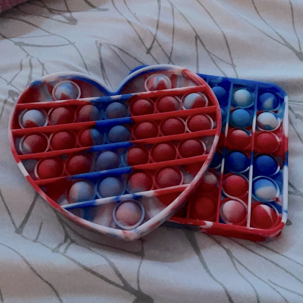 2 red whit and blue pop it’s.